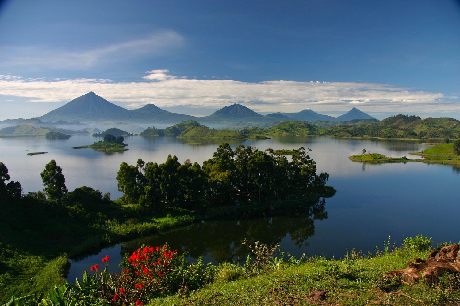 Lake Mutanda near Kisoro, Uganda, with the Virunga volcanoes rising behind